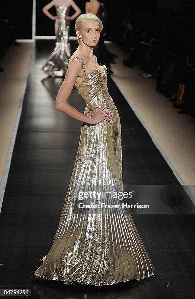 Model walks the runway at the Edition By Georges Chakra Fall 2009 fashion show during Mercedes-Benz Fashion Week in the Promenade at Bryant Park on...