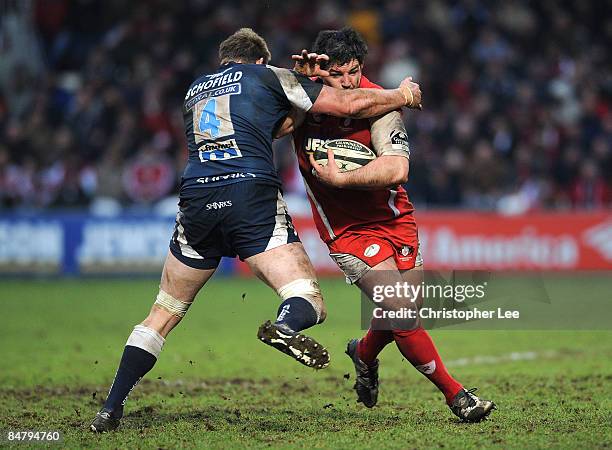 Olivier Azam of Gloucester battles with Dean Schofield of Sale during the Guinness Premiership match between Gloucester and Sale Sharks at Kingsholm...