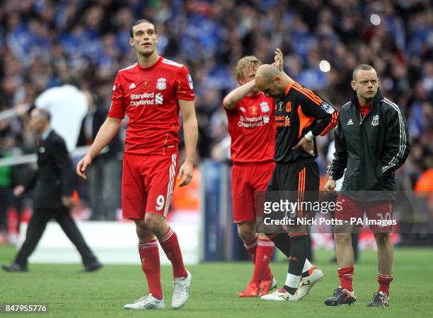 Liverpool's Andy Carroll, Dirk Kuyt, Jose Reina and Jay Spearing stand dejected after the final whistle