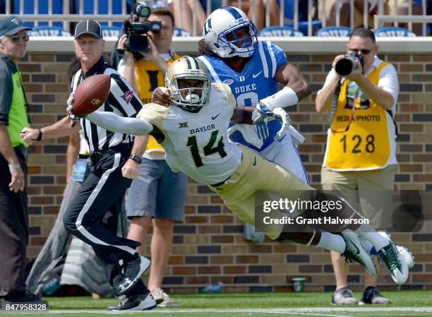 Jeremy McDuffie of the Duke Blue Devils breaks up a pass in the end zone intended for Chris Platt of the Baylor Bears during the game at Wallace Wade...