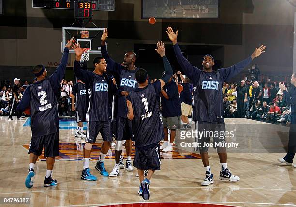 Mo Williams, Danny Granger, Kevin Garnett, Allen Iverson and LeBron James of the East All-Stars wave to the crowd during the East All-Stars practice...