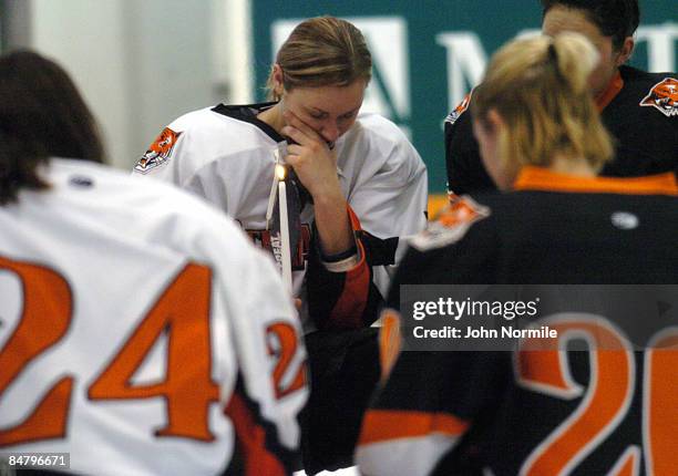 Female Hockey players honor Buffalo State University Alumni Madeline Loftus, who died along with 49 others in the plane crash of Continental flight...