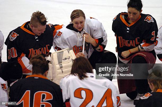 Female Hockey players honor Buffalo State University Alumni Madeline Loftus, who died along with 49 others in the plane crash of Continental flight...