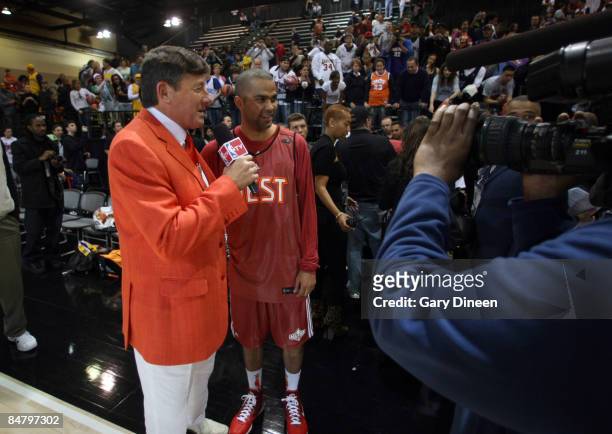 Personality Craig Sager interviews Tony Parker during the West All-Stars practice on center court during NBA Jam Session Presented by Adidas on...