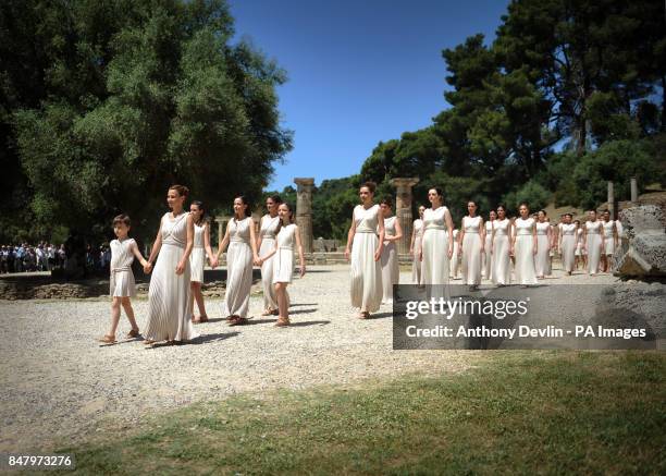 People dressed in the robes of the ancient Greeks rehearse at the Temple of Hera in Olympia, Greece, where the ancient Olympic Games took place,...