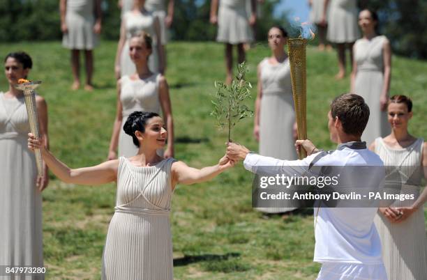 People dressed in the robes of the ancient Greeks rehearse at the Temple of Hera in Olympia, Greece, where the ancient Olympic Games took place,...