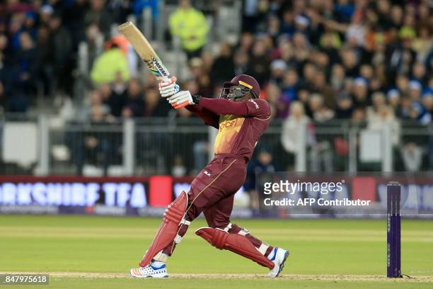 West Indies' Rovman Powell hits a six during the T20 International cricket match between England and West Indies at The Emirates Riverside,...