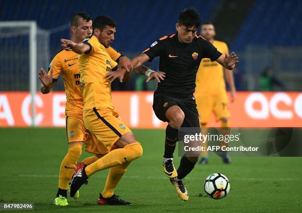 Roma's midfielder from Turchia Cengiz Under vies with Verona's midfielder from Italy Mattia Valoti during the Italian Serie A football match AS Roma...