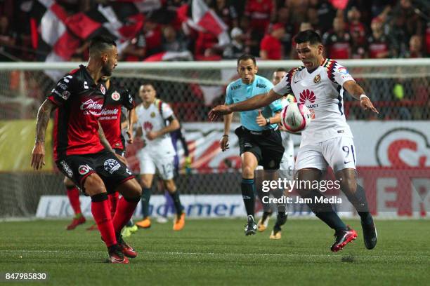 Silvio Romero of America competes for the ball with Victor Aguilera of Tijuana during the 9th round match between Tijuana and America as part of the...