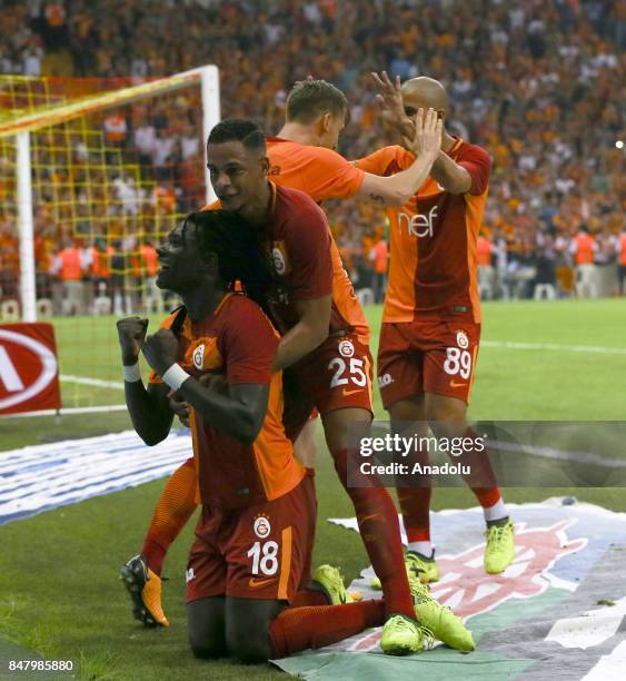 Gomis of Galatasaray celebrates with his teammates after scoring a goal during the fifth week of the Turkish Super Lig soccer match between...