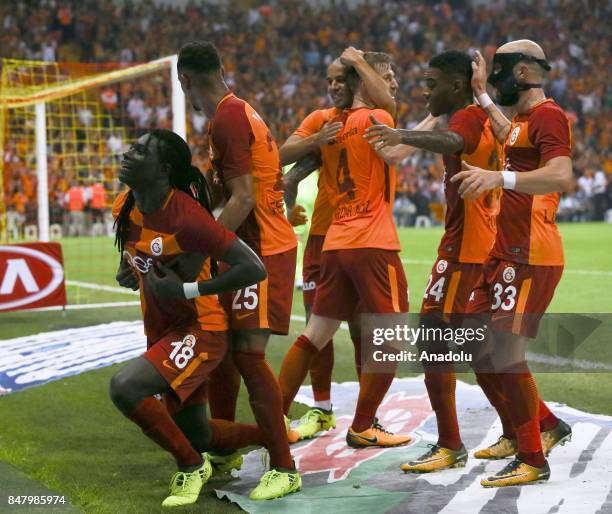 Gomis of Galatasaray celebrates with his teammates after scoring a goal during the fifth week of the Turkish Super Lig soccer match between...