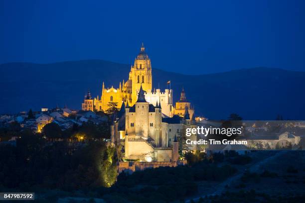 Famous spectacular view of Alcazar Castle - palace and fortress which inspired Disney castle, and Cathedral in Segovia, Spain.