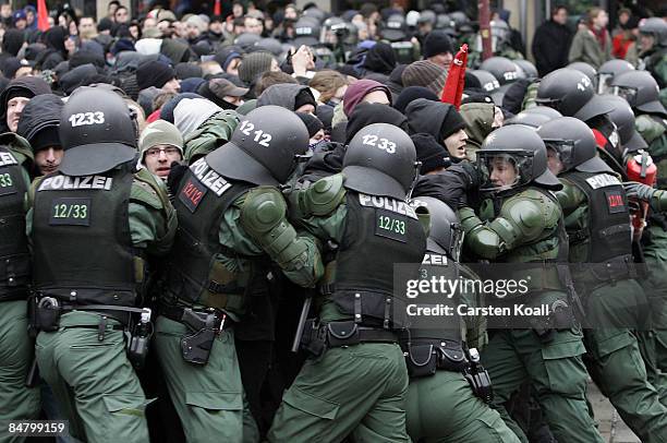 German riot police block left-wing protestors during a rally against a far-right march on February 14, 2009 in Dresden, Germany. Reportedly over...