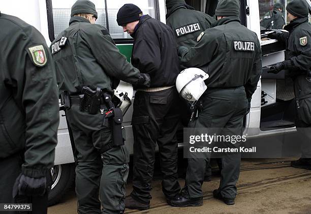 German riot police arrest protestors during a rally march on February 14, 2009 in Dresden, Germany. Reportedly over 10,000 people attended various...