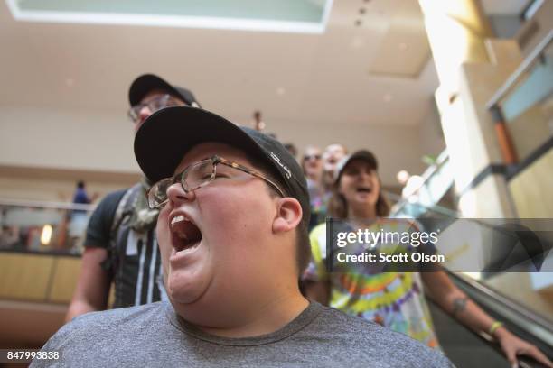 Demonstrators march through the West County Mall protesting the acquittal of former St. Louis police officer Jason Stockley on September 16, 2017 in...