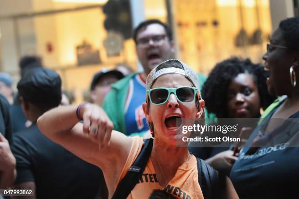 Demonstrators march through the West County Mall protesting the acquittal of former St. Louis police officer Jason Stockley on September 16, 2017 in...