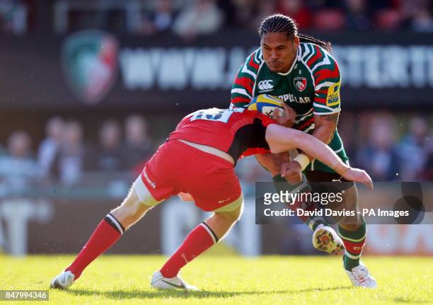 Leicester's Alesana Tuilagi is tackled by Saracens' Owen Farrell during the Aviva Premiership Semi Final match at Welford Road, Leicester.