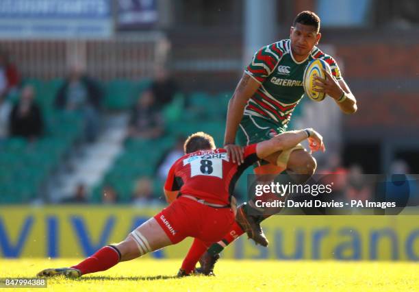 Leicester's Steve Mafi is tackled by Saracens' Ernst Joubert during the Aviva Premiership Semi Final match at Welford Road, Leicester.