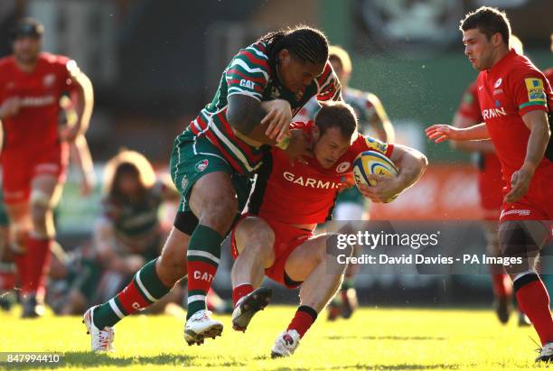 Saracens James Short is tackled by Leicester's Alesana Tuilagi during the Aviva Premiership Semi Final match at Welford Road, Leicester.