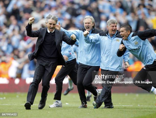 Manchester City's manager Roberto Mancini celebrates during the Barclays Premier League match at the Etihad Stadium, Manchester.