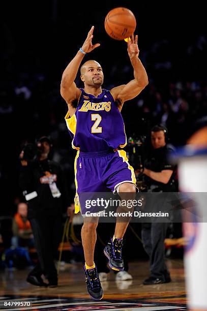 Derek Fisher of Los Angeles shoots a half-court shot in the Haier Shooting Stars on All-Star Saturday Night, part of 2009 NBA All-Star Weekend at US...