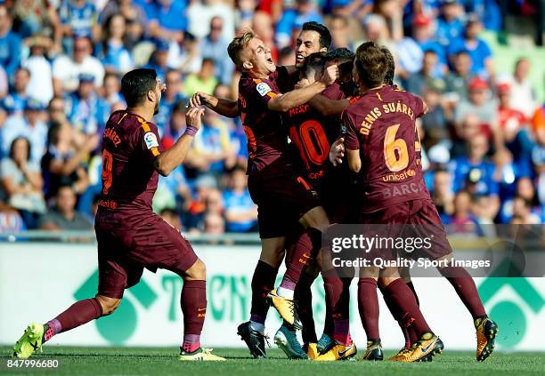 Paulinho of Barcelona celebrates scoring his team's second goal with his teammates during the La Liga match between Getafe and Barcelona at Coliseum...