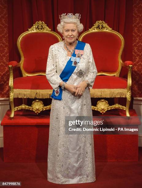 The new waxwork figure of Queen Elizabeth II, made to coincide with her Diamond Jubilee, during its unveiling at Madame Tussauds, in central London.