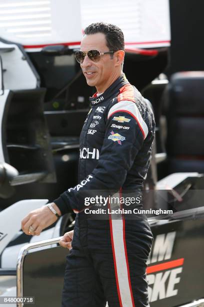 Helio Castroneves of Brazil driver of the Hitachi Chevrolet walks to pit lane during practice on day 2 of the GoPro Grand Prix of Somoma at Sonoma...