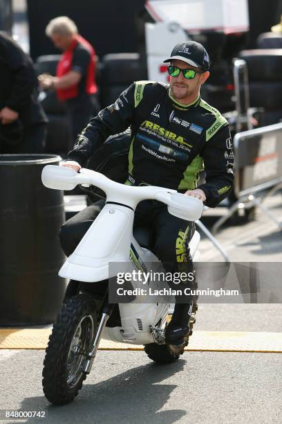 Charlie Kimball of the United States driver of the Tresiba Honda rides to pit lane during practice on day 2 of the GoPro Grand Prix of Somoma at...