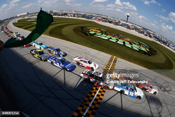 Erik Jones, driver of the NBA 2K18/GameStop Toyota, and Daniel Suarez, driver of the Comcast Business/Juniper Toyota, lead the field to the green...