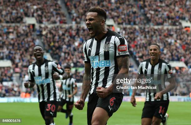 Jamaal Lascelles of Newcastle United celebrates after he scores the winning goal during the Premier League match between Newcastle United and Stoke...