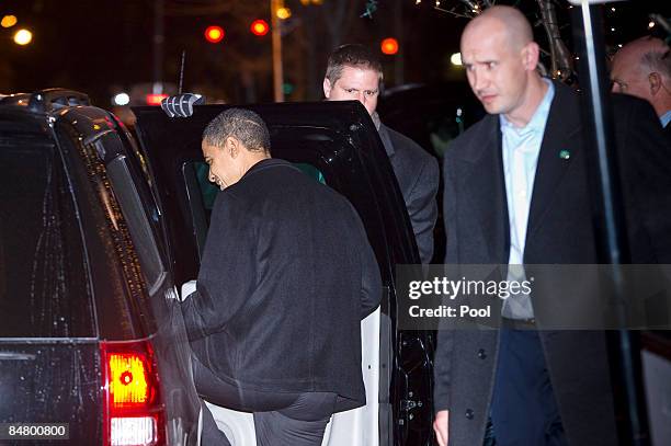 President Barack Obama enters his vehicle after dining with first lady Michelle Obama at Table 52 for Valentine's Day on February 14, 2009 in...