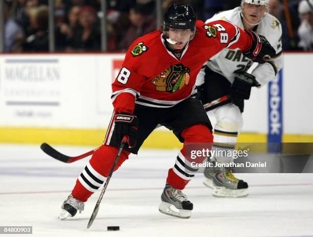 Patrick Kane of the Chicago Blackhawks brings the puck up the ice against the Dallas Stars on February 14, 2009 at the United Center in Chicago,...