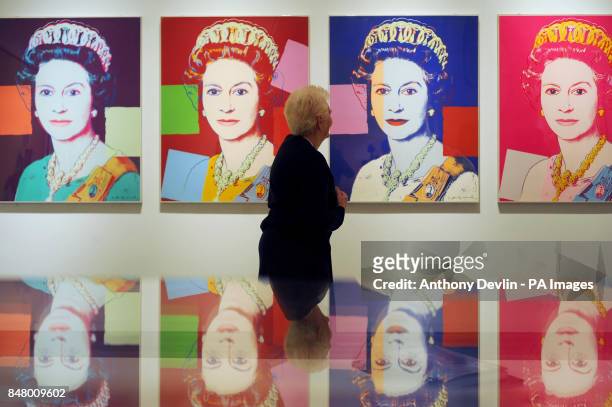 Denise Silvester-Carr, 73 from Bexley, views Queen Elizabeth II by Andy Warhol during the press preview of The Queen: Art and Image at the National...