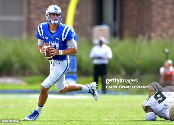 Daniel Jones of the Duke Blue Devils rolls out against the Baylor Bears during the game at Wallace Wade Stadium on September 16, 2017 in Durham,...