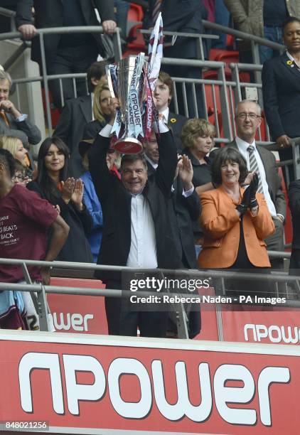 West Ham United manager Sam Allardyce celebrates with the Championship Play-Off Trophy as they gain promotion to the Barclays Premier League