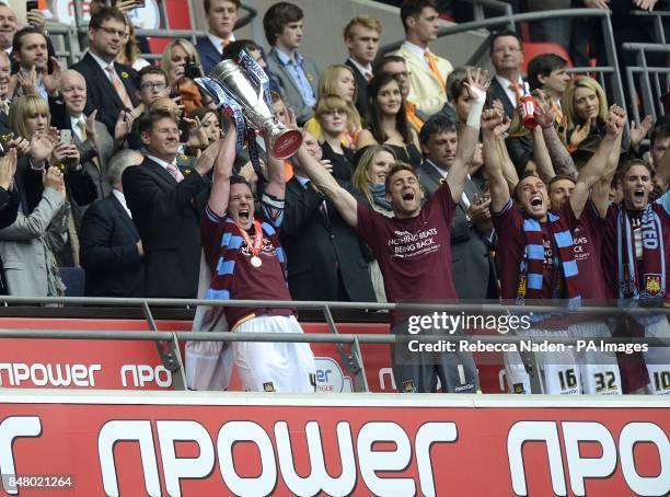 West Ham United's captain Kevin Nolan lifts the Championship Play-Off Trophy