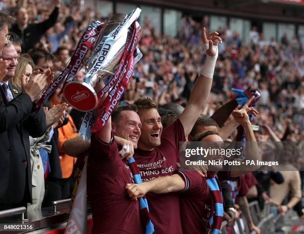 West Ham United's Kevin Nolan , Robert Green and Mark Noble celebrate with the Championship Play-Off Trophy