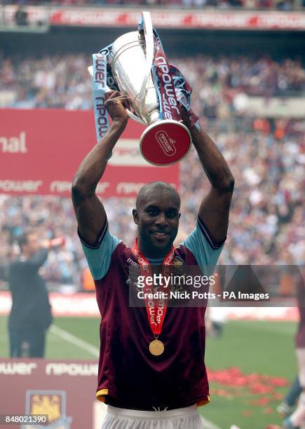 West Ham United's Carlton Cole celebrates with the Championship Play-Off Trophy
