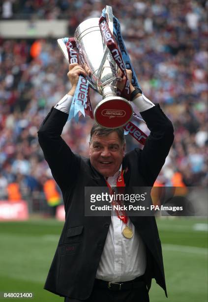 West Ham United manager Sam Allardyce celebrates with the Championship Play-Off Trophy