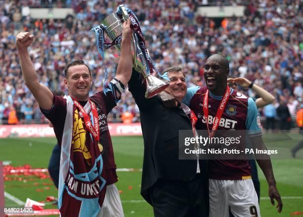 West Ham United's Kevin Nolan , Carlton Cole and manager Sam Allardyce celebrate with the Championship Play-Off Trophy