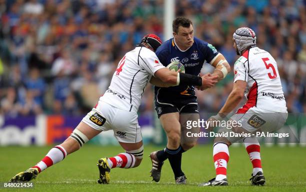 Leinster's Cian Healy is tackled by Ulster's Johann Muller during the Heinken Cup Final at Twickenham, London.
