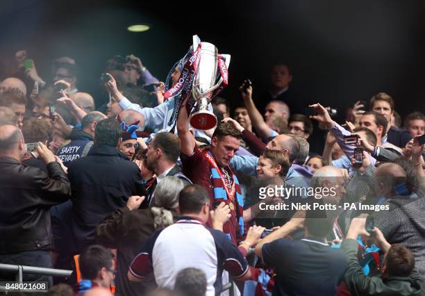 West Ham United's Kevin Nolan celebrates with the Championship Play-Off Trophy in the stands with the crowd