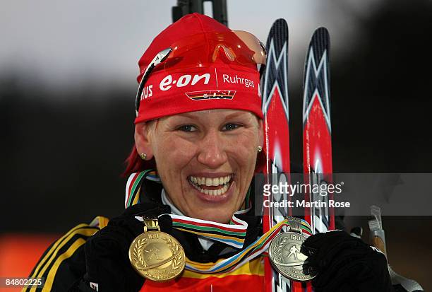 Kathi Wilhelm of Germany poses with the silver and bronze medal after the Women 10 km pusuit of the IBU Biathlon World Campionships on February 15,...