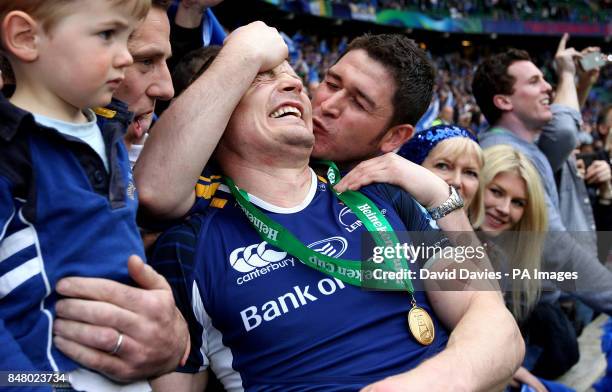 Leinster's Brian O'Drsicoll gets a kiss from a fan aftertheir victory over Ulster during the Heinken Cup Final at Twickenham, London.