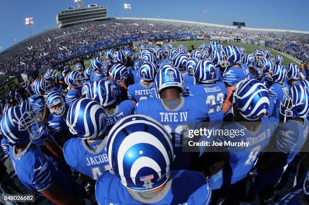 The Memphis Tigers huddle before the game against the UCLA Bruins on September 16, 2017 at Liberty Bowl Memorial Stadium in Memphis, Tennessee....