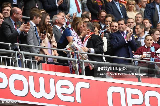 West Ham United manager Sam Allardyce receives a kiss from West Ham United vice Chairman Karren Brady as he carries the Championship Play Off trophy...