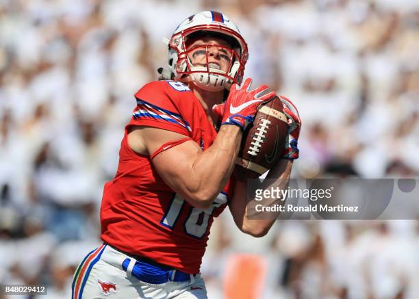 Trey Quinn of the Southern Methodist Mustangs makes a touchdown pass reception in the first half against the TCU Horned Frogs at Amon G. Carter...