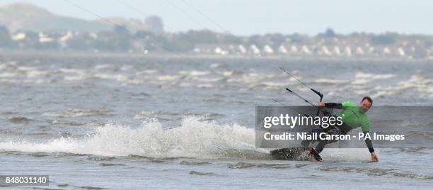 Kite surfer takes to the waves on Dublins Dollymount Strand in Dublin as temperatures rise across the country.