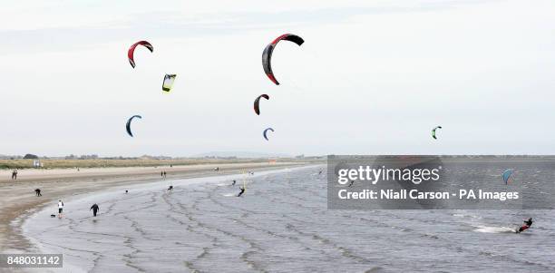 Kite surfers take to the waves on Dublins Dollymount Strand in Dublin as temperatures rise across the country.